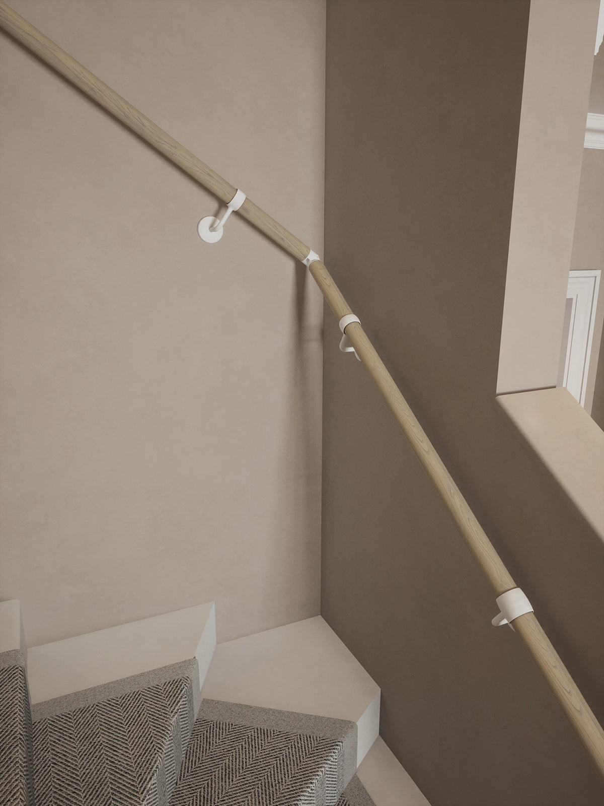 Ryton Teak Single Winder Handrail with Edstone Matt White brackets and an adjustable elbow following the staircase turn.