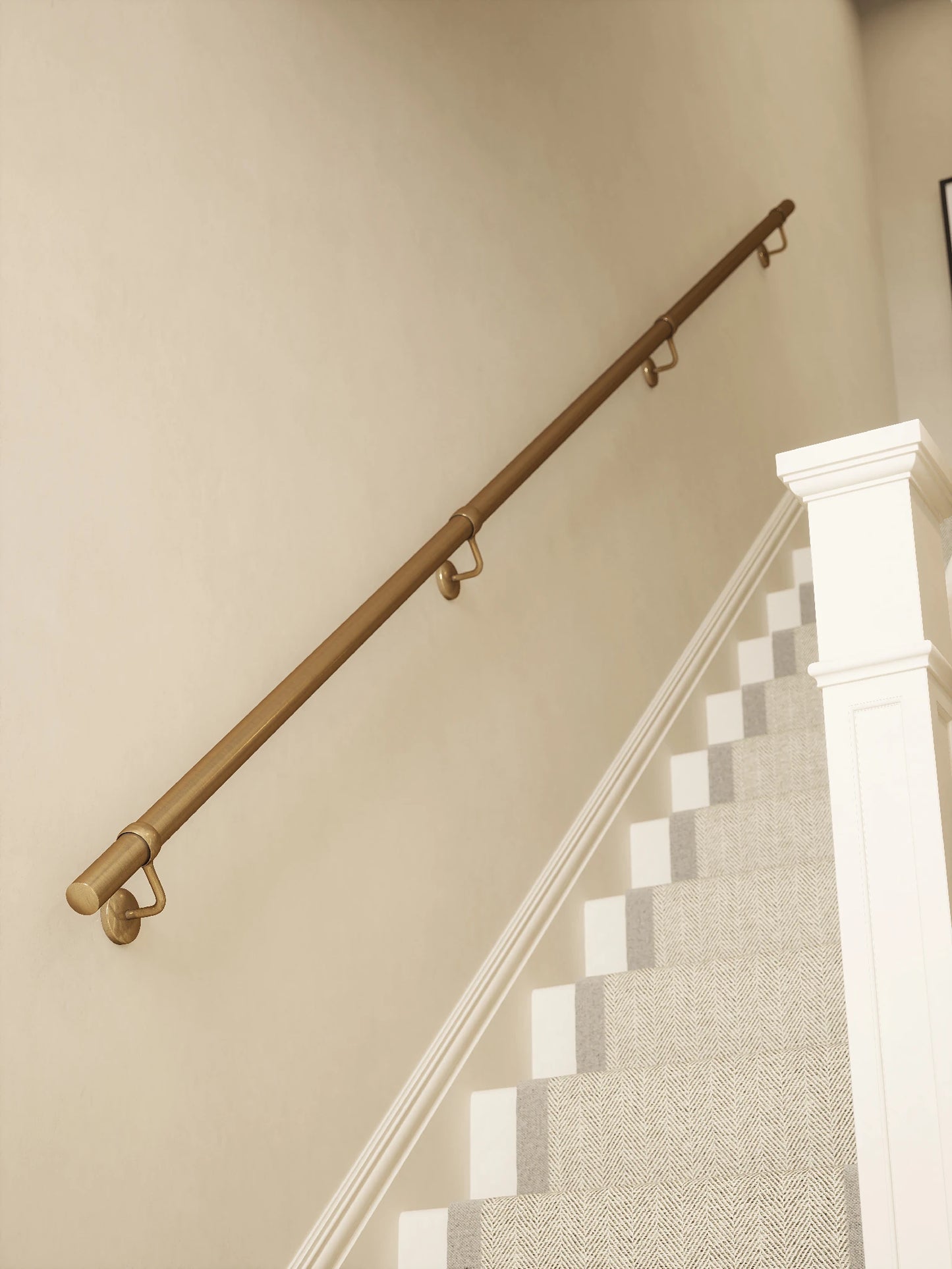 Antique brass 3.6m straight run handrail installed on staircase wall, angled view