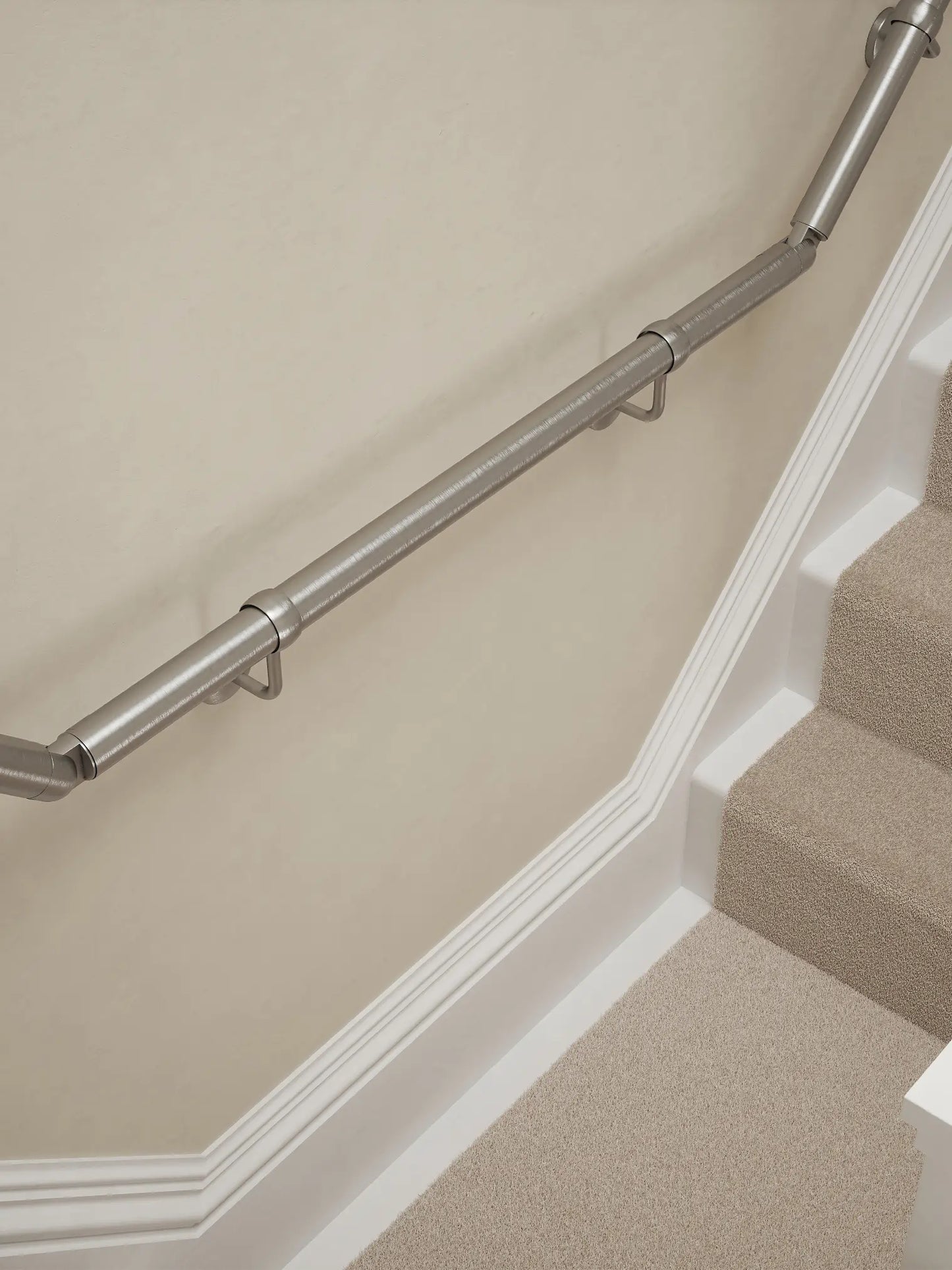 Harbury Brushed Silver wall-mounted handrail installed on a T-shape staircase, alternate front view – Handrails Direct UK supplier of modular indoor handrails and fittings
