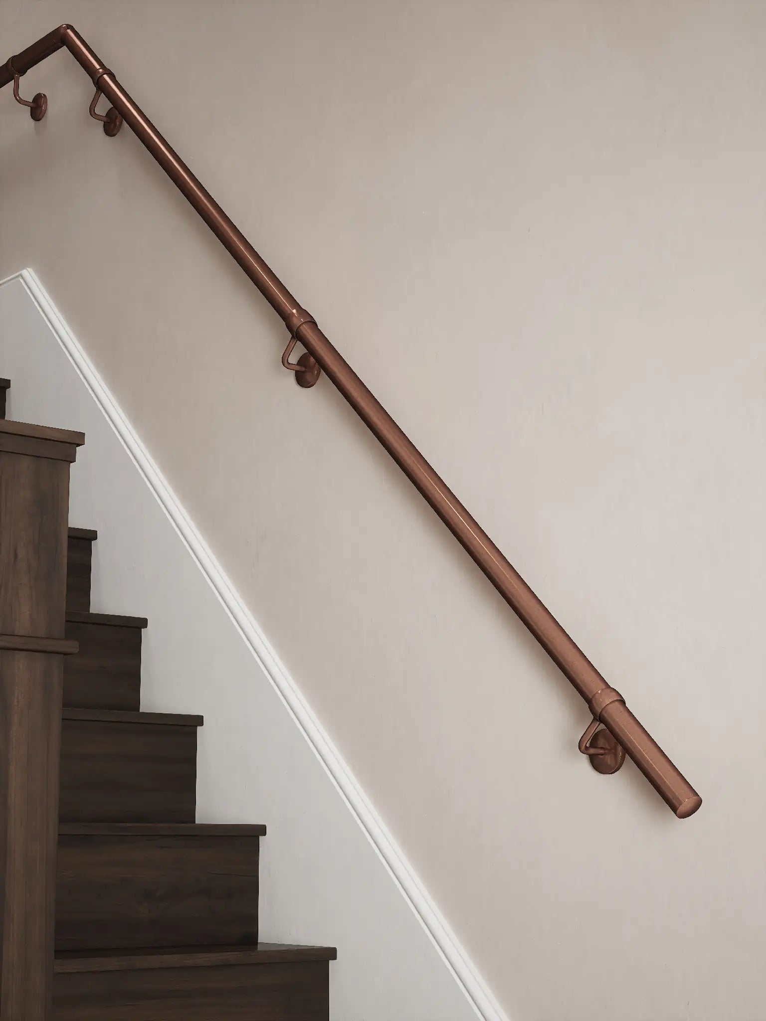 Sambourne Antique Copper Quarter Landing Handrail showing rise and elbow