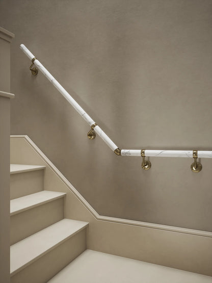Montford Soft White Marble Quarter Landing Handrail with Loxley Antique Brass brackets