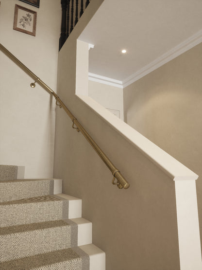 Loxley Antique Brass single winder handrail rising to the landing