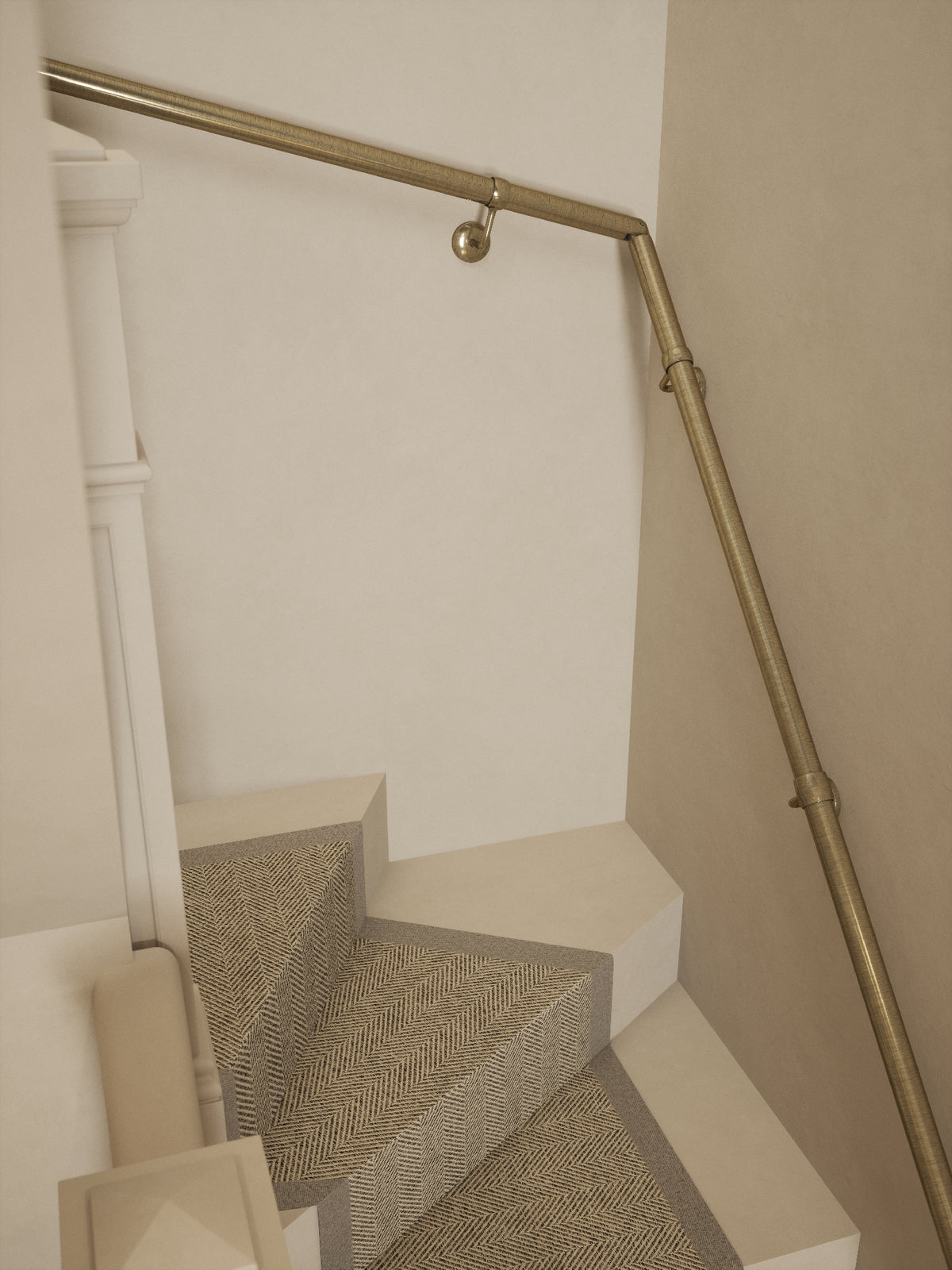 Top-down view of the Loxley Antique Brass single winder handrail following the winder turn