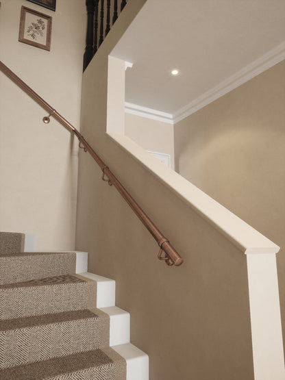 Sambourne Antique Copper single winder handrail rising to the landing
