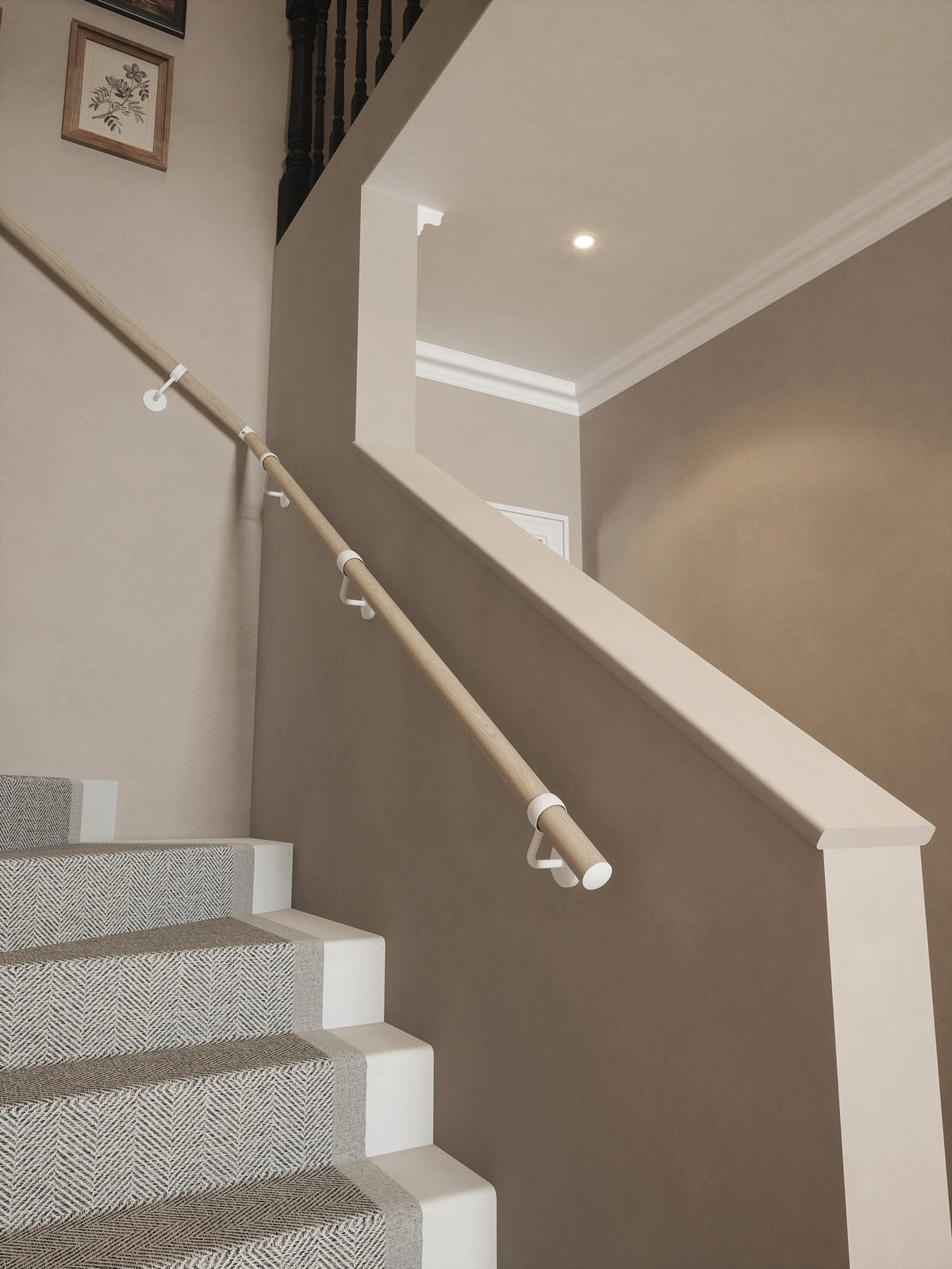 Ryton Teak Single Winder Handrail with Edstone Matt White brackets and end cap, following the staircase turn.