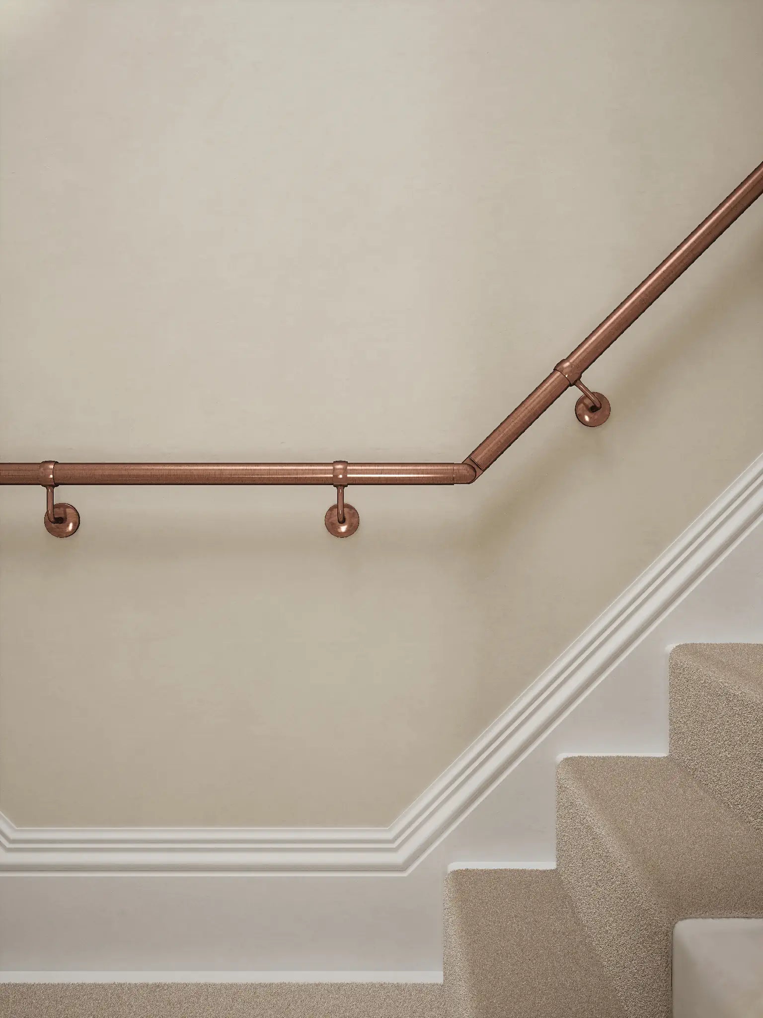 Sambourne Antique Copper T Shape Handrail showing brackets and elbow to final rise