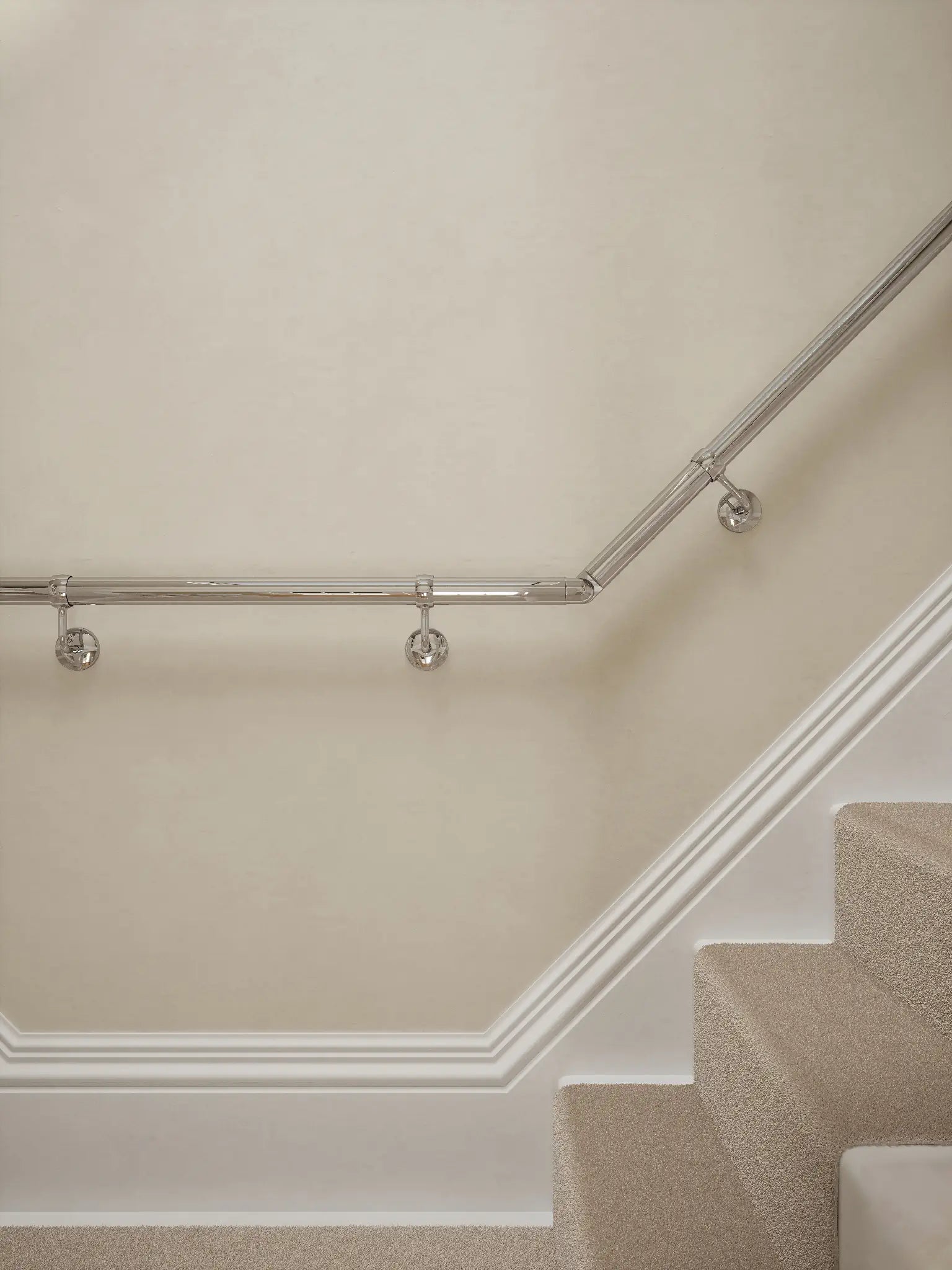 close up of the Radway Chrome T-shape handrail system showing brackets and elbow.