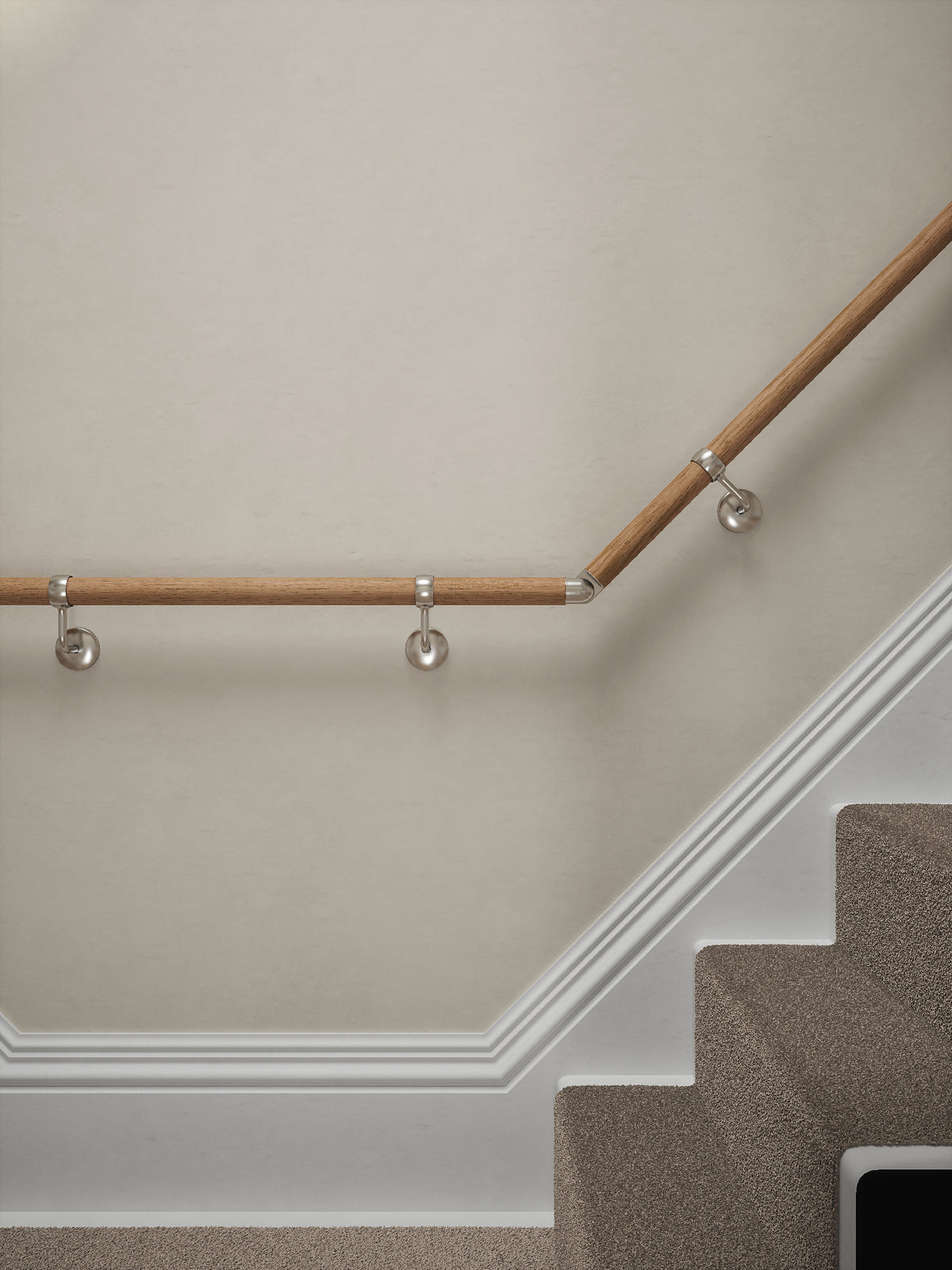 Stoneleigh Red Oak T-shape handrail with silver wall brackets at the turn