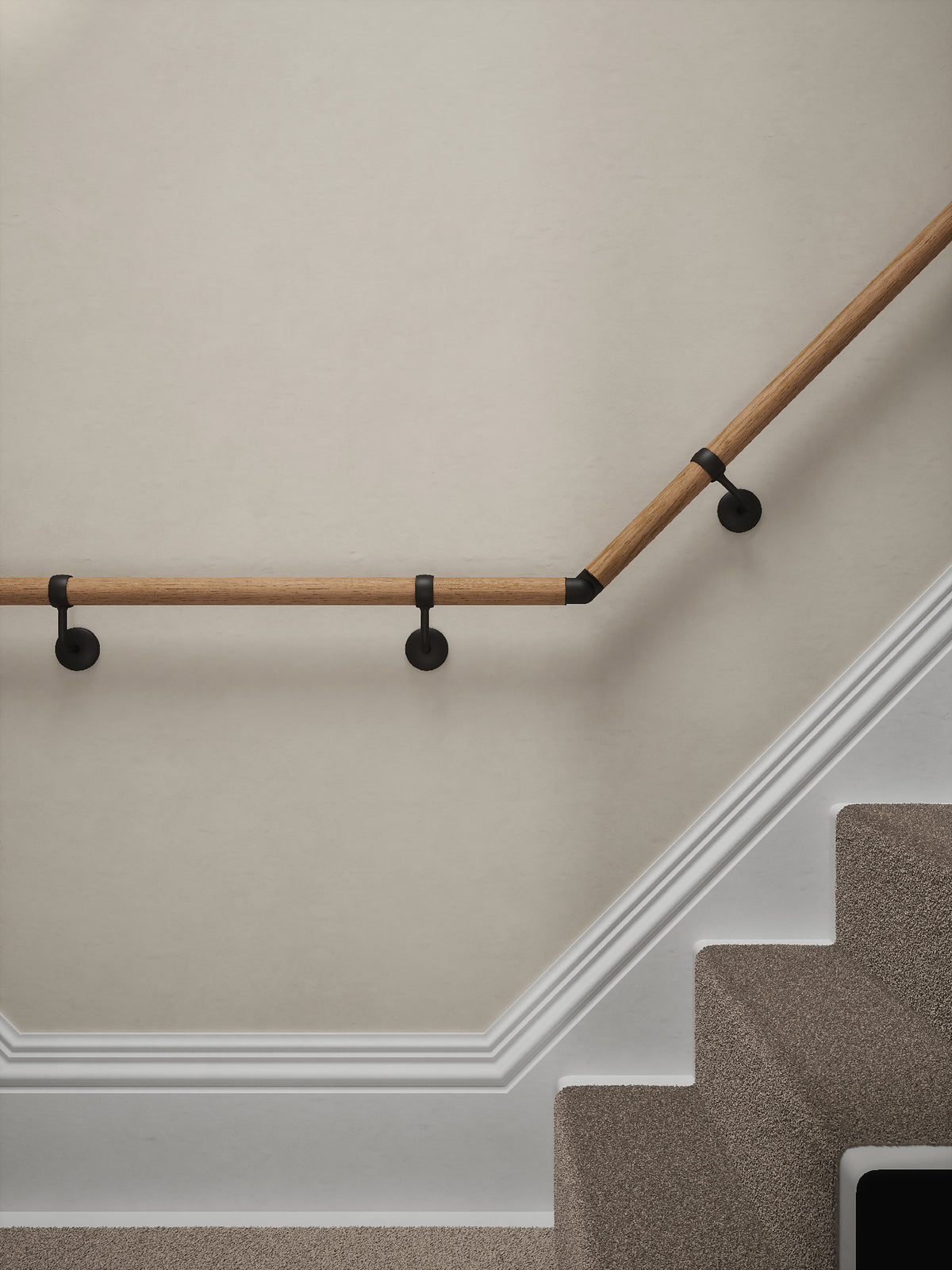 Stoneleigh Red Oak T-shape handrail with matt black wall brackets at the turn