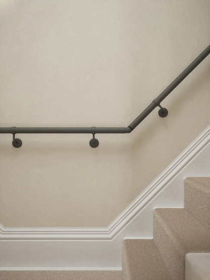Luddington textured grey t shape handrail showing brackets and elbows with a rise.