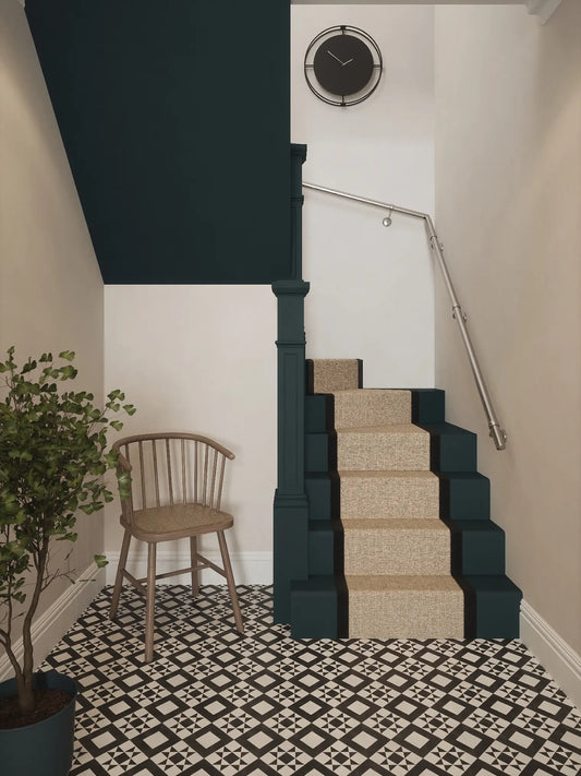 Brushed silver 40mm double winder handrail installed on staircase wall, front view