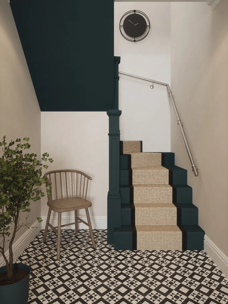 Brushed silver 40mm double winder handrail installed on staircase wall, front view