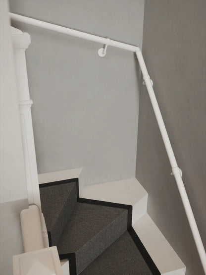 Matt white 40mm double winder handrail following staircase turn, angled view