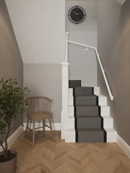 Matt white 40mm double winder handrail installed on staircase wall, front view