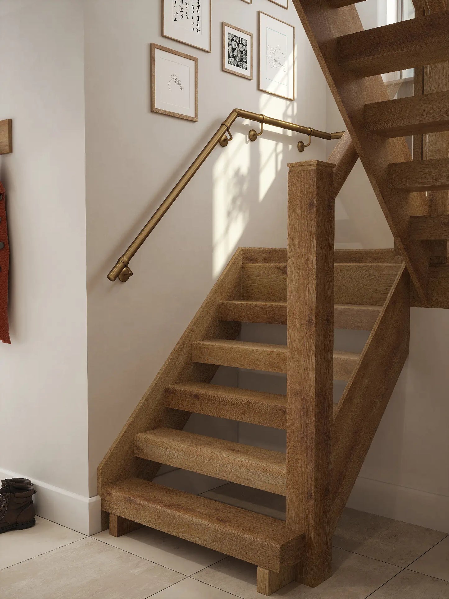 Antique brass 40mm half turn handrail fitted to staircase wall, angled view