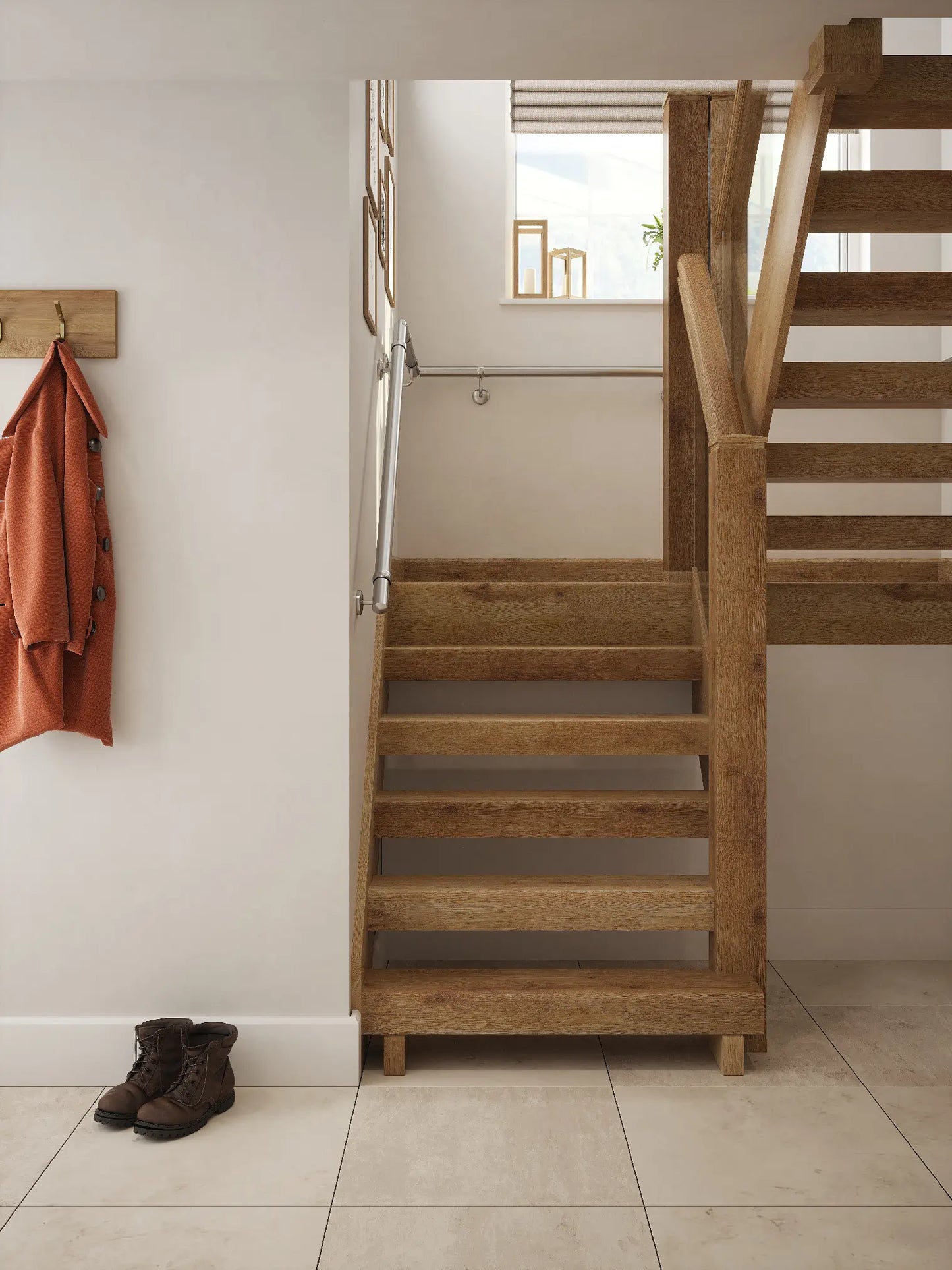 Brushed silver 40mm half turn handrail installed along hallway staircase wall, front view