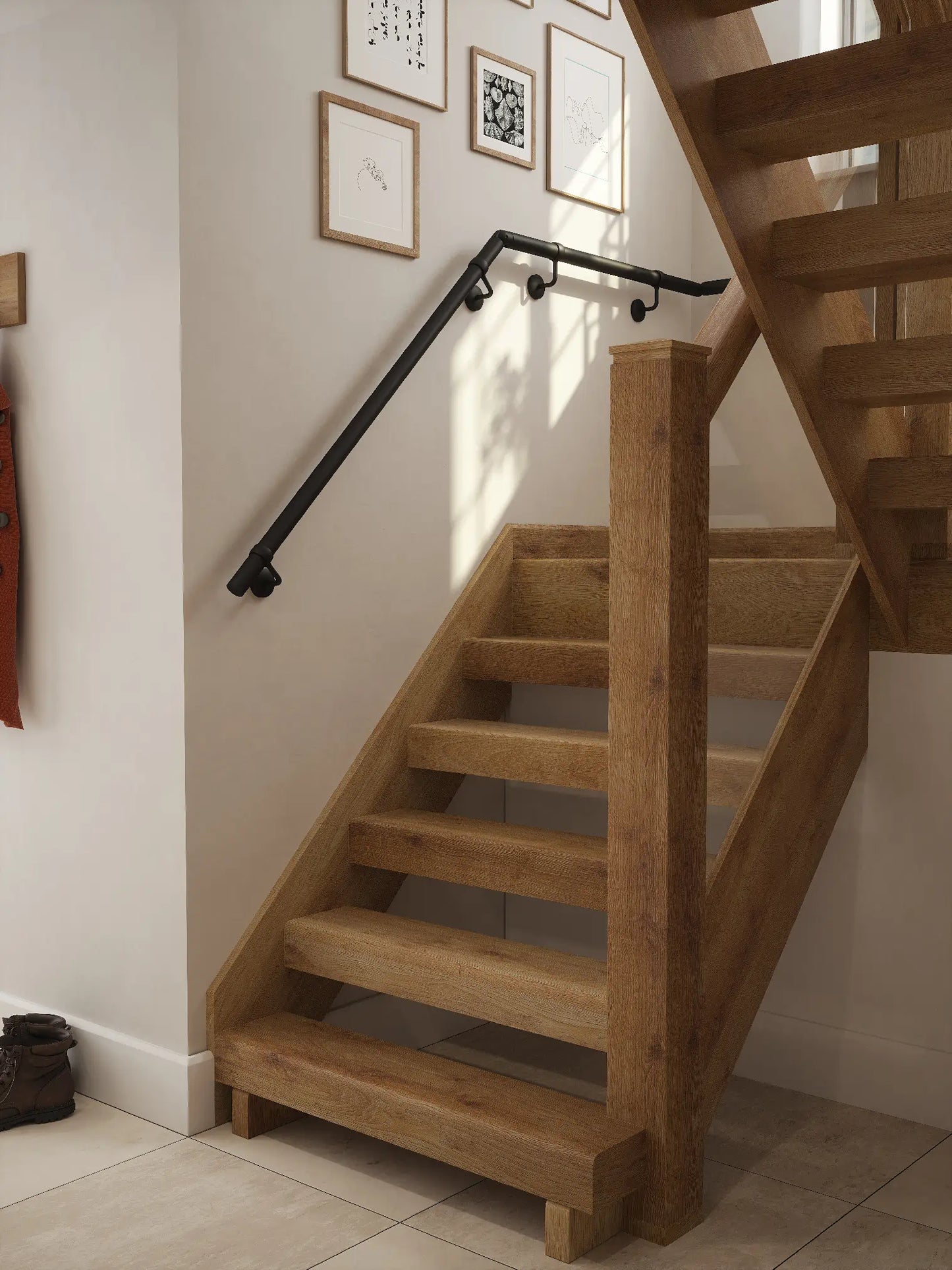 Matt black half turn handrail fitted to staircase wall, angled view