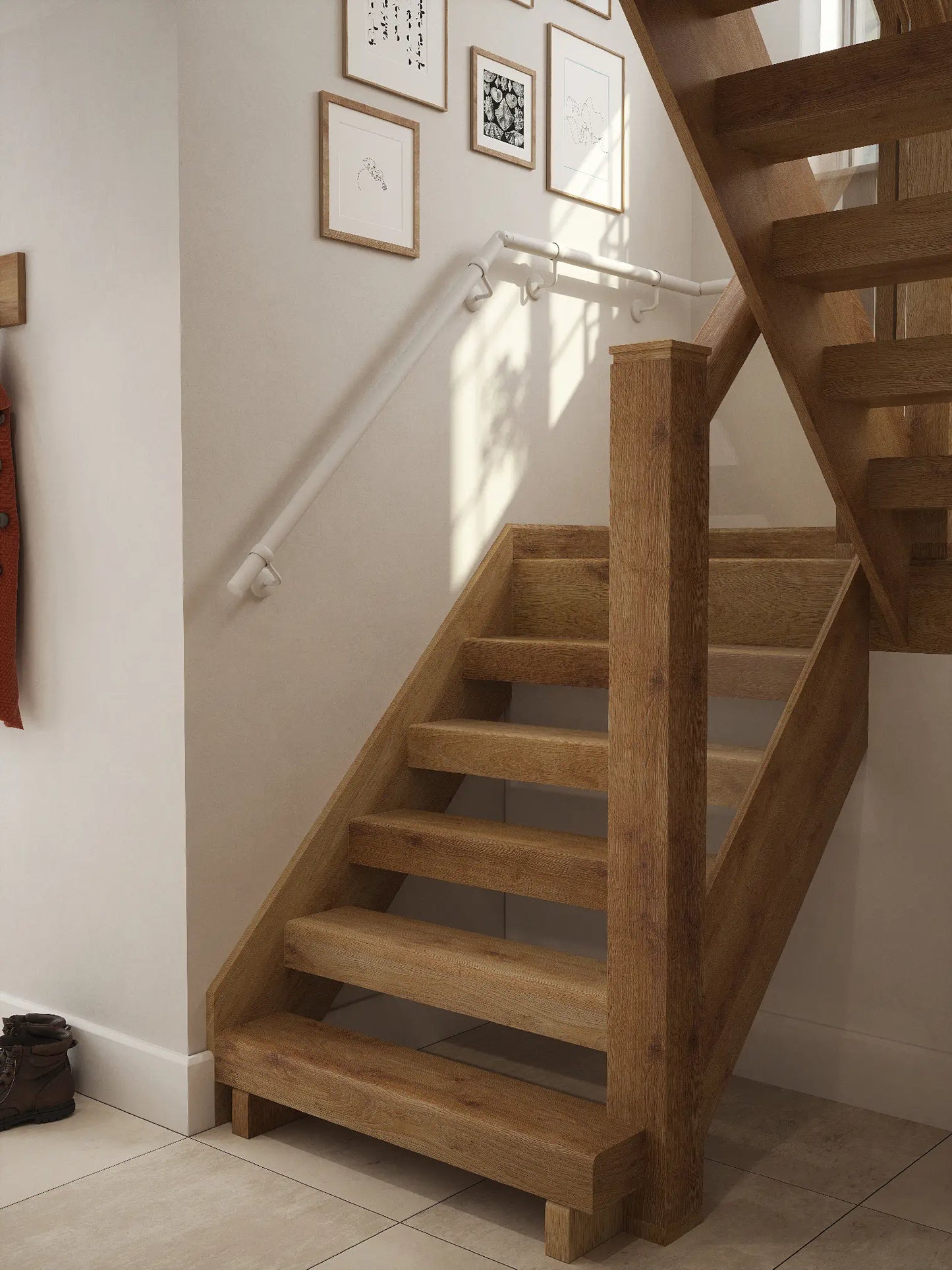 Matt white 40mm half turn handrail fitted to staircase wall, angled view