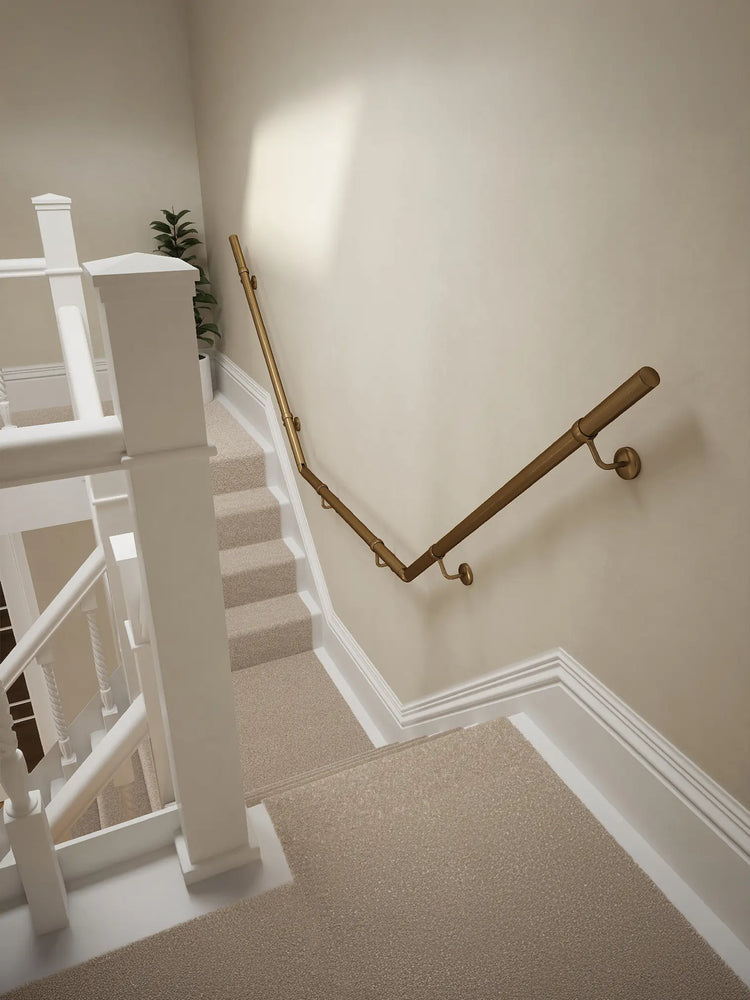 Loxley Antique Brass wall-mounted handrail on a T-shape staircase, top-down view – Handrails Direct UK supplier of modular indoor handrails and fittings
